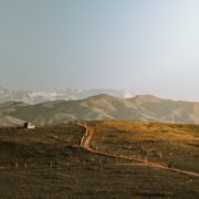 Panoramic golden-hour view of the Agafay Desert near Marrakech at Oasis Sky