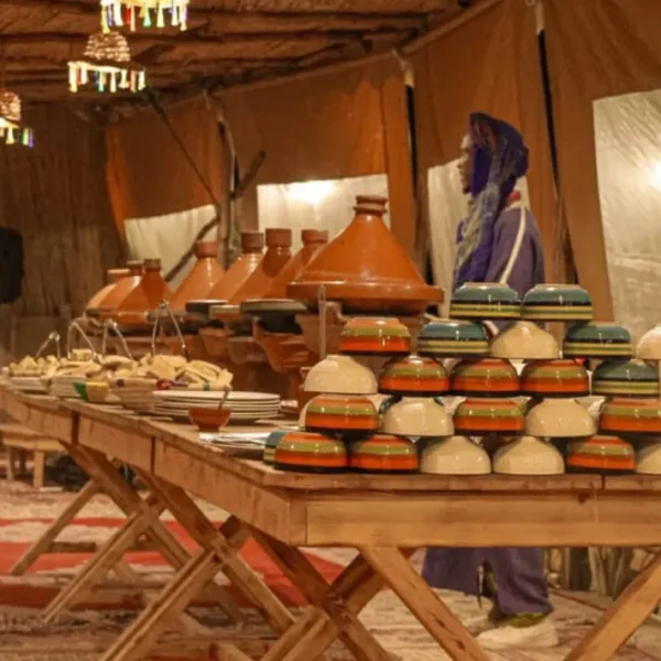 Agafay Desert Marrakech Tours Traditional Moroccan dining setup inside a desert camp in Agafay Desert Marrakech
