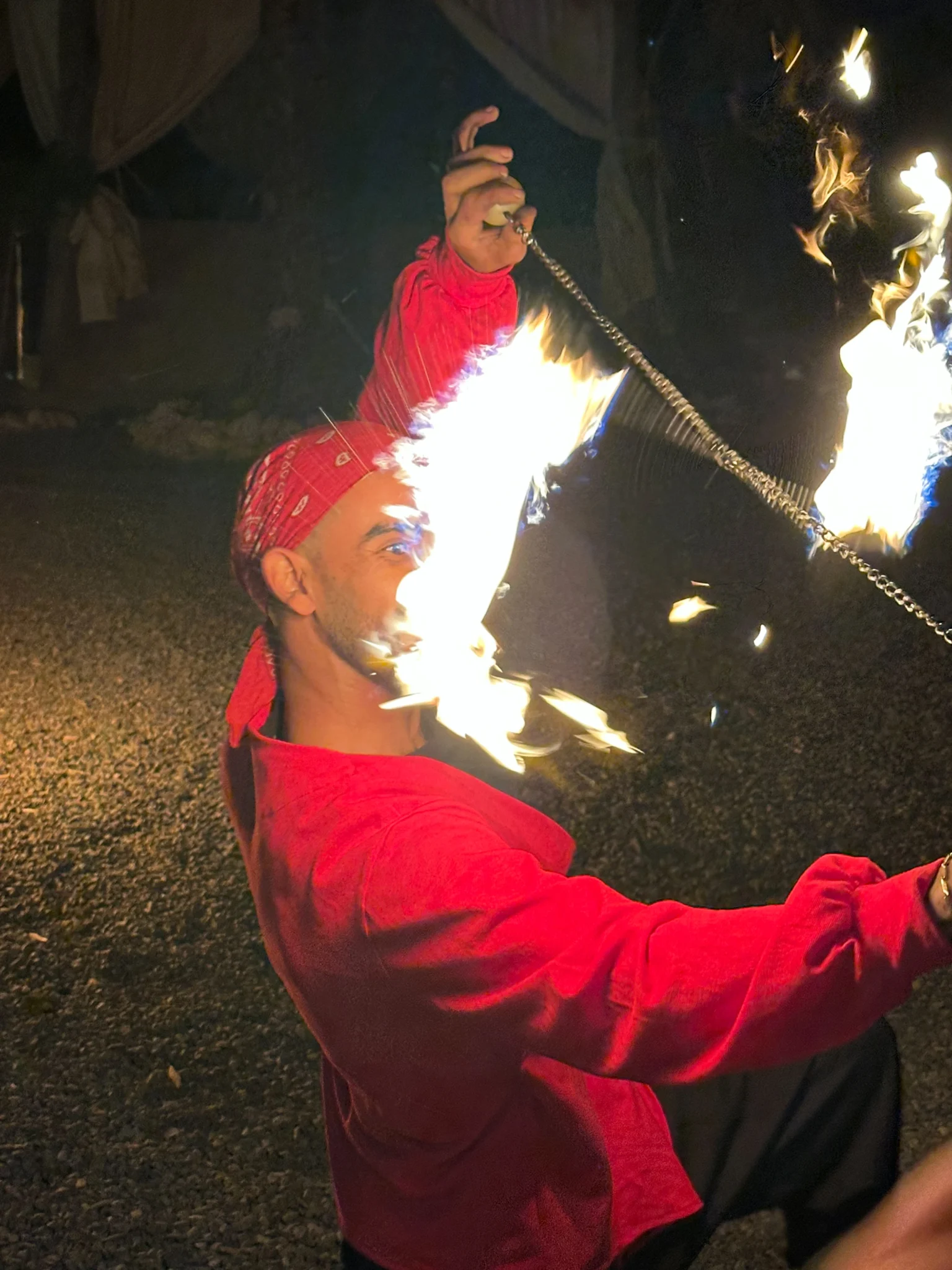 Fire show during an evening dinner experience in the Agafay Desert near Marrakech