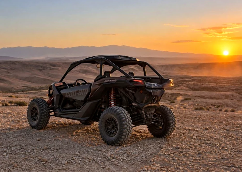 Black Can-Am buggy at sunset in Agafay Desert near Marrakech, for the Oasis Sky buggy ride and Moroccan dinner show experience