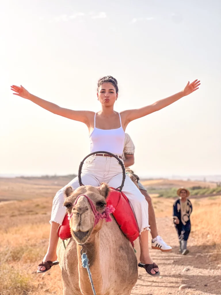 Traveler enjoying a camel ride in the Agafay Desert near Marrakech