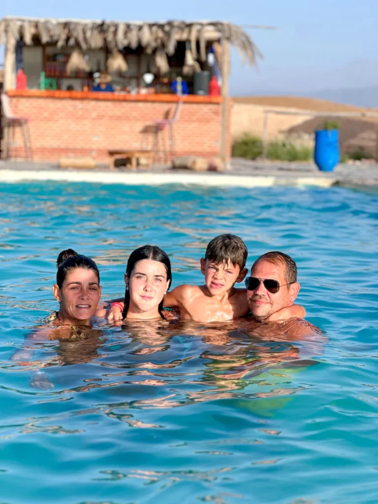Family enjoying a swimming pool experience in the Agafay Desert near Marrakech