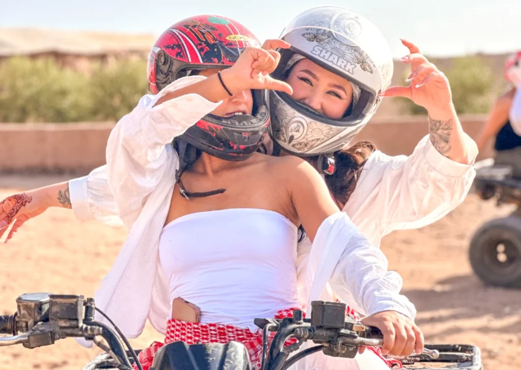 Friends enjoying quad biking in the Agafay Desert near Marrakech