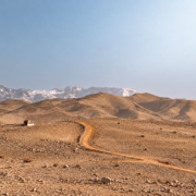 Panoramic Agafay Desert sunset with golden hills near Marrakech Morocco