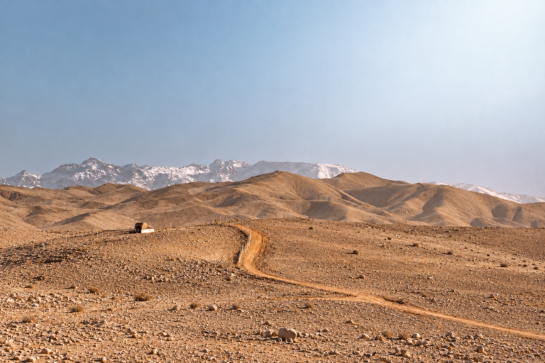 Panoramic Agafay Desert sunset with golden hills near Marrakech Morocco